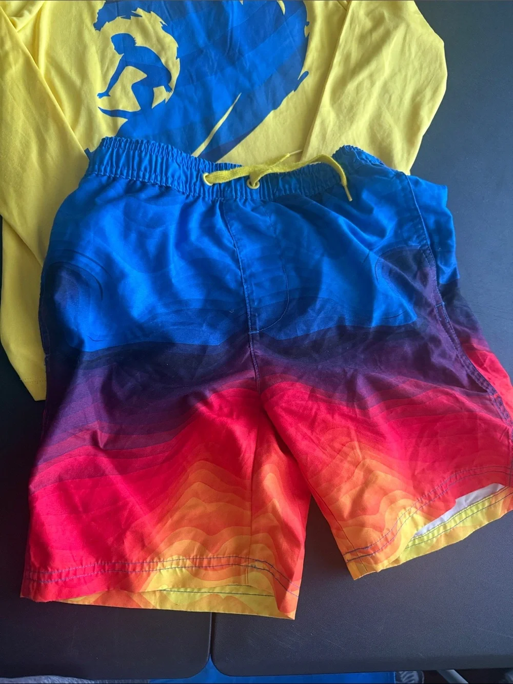 Yellow Rash Guard with Blue Surf Graphic & Sunrise Ombre Board Shorts